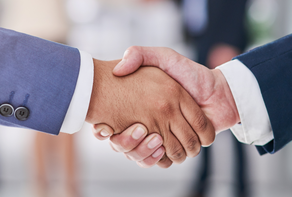 Handshake between partners -reflecting trusted partnerships services offered internationally from Guernsey